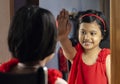 a cute girl in front of mirror Royalty Free Stock Photo