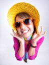 Cute girl with funny hat smiling in the studio Royalty Free Stock Photo