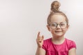 Cute girl with hairbun giving advise to her little sister Royalty Free Stock Photo