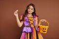 cute girl in Halloween costume holding Royalty Free Stock Photo