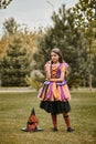 cute girl in Halloween costume standing