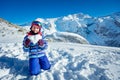 Cute girl with heart shaped snow show love to ski Royalty Free Stock Photo