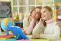 Cute girl with her mother doing homework Royalty Free Stock Photo