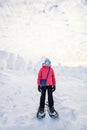 Cute girl hiking in snowshoes Royalty Free Stock Photo