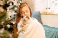 Cute girl holding a cat in her arms. care and responsibility for children, care for animals Royalty Free Stock Photo