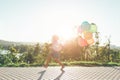 Cute girl holding colorful balloons in the city park, playing, r Royalty Free Stock Photo