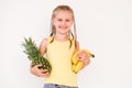 Cute girl holding exotic fruits Royalty Free Stock Photo
