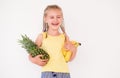 Cute girl holding exotic fruits Royalty Free Stock Photo