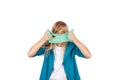 Cute girl holding green slime looks like gunk in front of her face Royalty Free Stock Photo