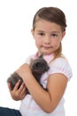 Cute girl holding grey kitten smiling at camera Royalty Free Stock Photo