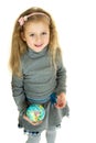 Cute girl holding small globe in her hands Royalty Free Stock Photo