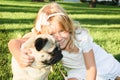 Cute girl hugging with lovely dog at the park Royalty Free Stock Photo