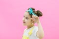 Cute girl keeping left hand up. Little girl looks suprised Royalty Free Stock Photo