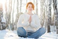 Young beautiful woman praying in forest Royalty Free Stock Photo