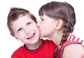 Cute girl kissing a blue eyed boy Royalty Free Stock Photo