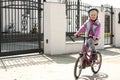 Cute girl learns to ride a bike