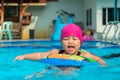 Cute girl or little child playing in swimming pool happily Royalty Free Stock Photo