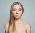 Cute girl with long straight blonde hair and healthy skin. Beautiful female face. Facial treatment, haircare, facial lifting