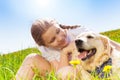Cute girl looking close at dog and hugging it Royalty Free Stock Photo