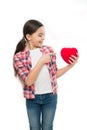 Cute girl in love. Little girl pointing finger at red heart. Little child expressing love on valentines day. Having