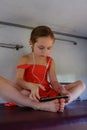 Girl lying on the top shelf in the train.Summer Vacation and Travel Concept. the girl in the train lies on the top shelf