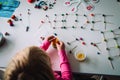 Girl making letters, geometric shapes from sticks and clay, engineering and STEM Royalty Free Stock Photo