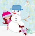 Cute girl making snowman