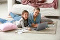 Cute girl with mother doing homework at home Royalty Free Stock Photo