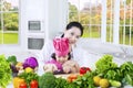Cute girl and mother preparing vegetables