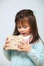 Cute girl opening gift box Royalty Free Stock Photo