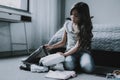 Cute Girl Packing Bag Sitting on Floor in Bedroom Royalty Free Stock Photo