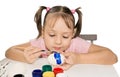 Cute girl painting easter eggs