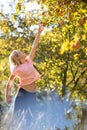 Cute girl picking apples in an orchard Royalty Free Stock Photo