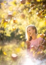 Cute girl picking apples in an orchard Royalty Free Stock Photo