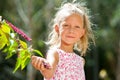 Cute girl picking wild berries. Royalty Free Stock Photo