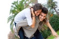 Cute girl piggybacking on boyfriend. Royalty Free Stock Photo