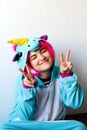 Woman in kigurumi unicorn costume Royalty Free Stock Photo