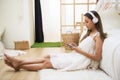 cute girl play smartphone in bedroom Royalty Free Stock Photo