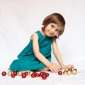 Cute girl playin with christmas decorations Royalty Free Stock Photo