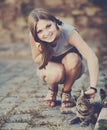 Cute girl playing with cat