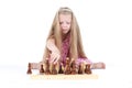 Cute girl playing chess on white Royalty Free Stock Photo