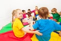 Cute girl playing circle games with friends in gym Royalty Free Stock Photo