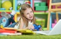 Cute girl playing computer game at home Royalty Free Stock Photo