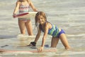 Cute Girl Playing in the Ocean on a boogie board Royalty Free Stock Photo