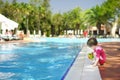 Cute girl playing in swimming pool Royalty Free Stock Photo