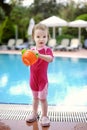 Cute girl playing in swimming pool Royalty Free Stock Photo