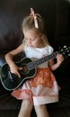 Cute girl playing ukulele Royalty Free Stock Photo