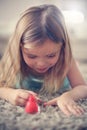 Cute girl. Portrait of little girl polish her nails. Royalty Free Stock Photo