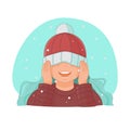 Girl pulled her hat over her eyes and rejoices in the falling snow