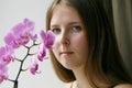 Cute girl with a purple orchid